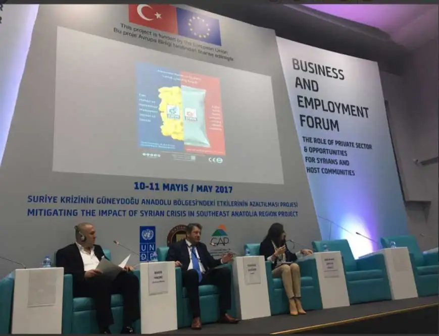 making a statement in front of representatives from the united nations and the turkish government