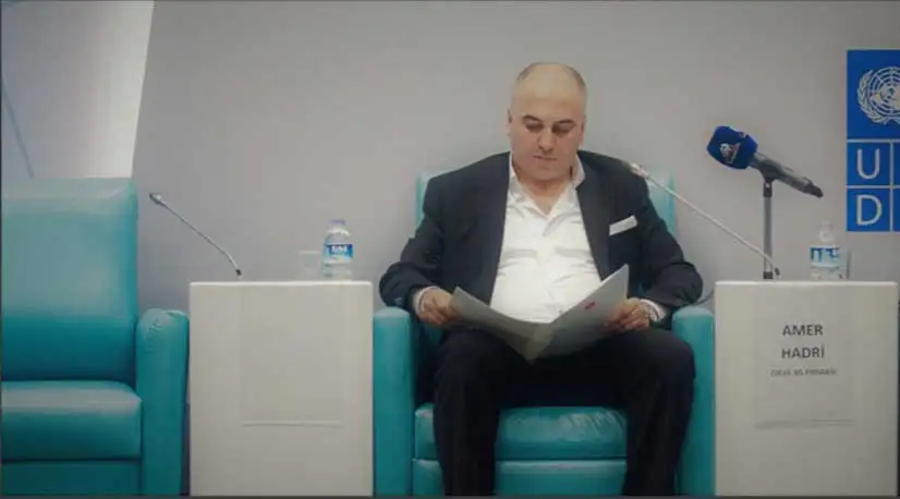 making a statement in front of representatives from the united nations and the turkish government